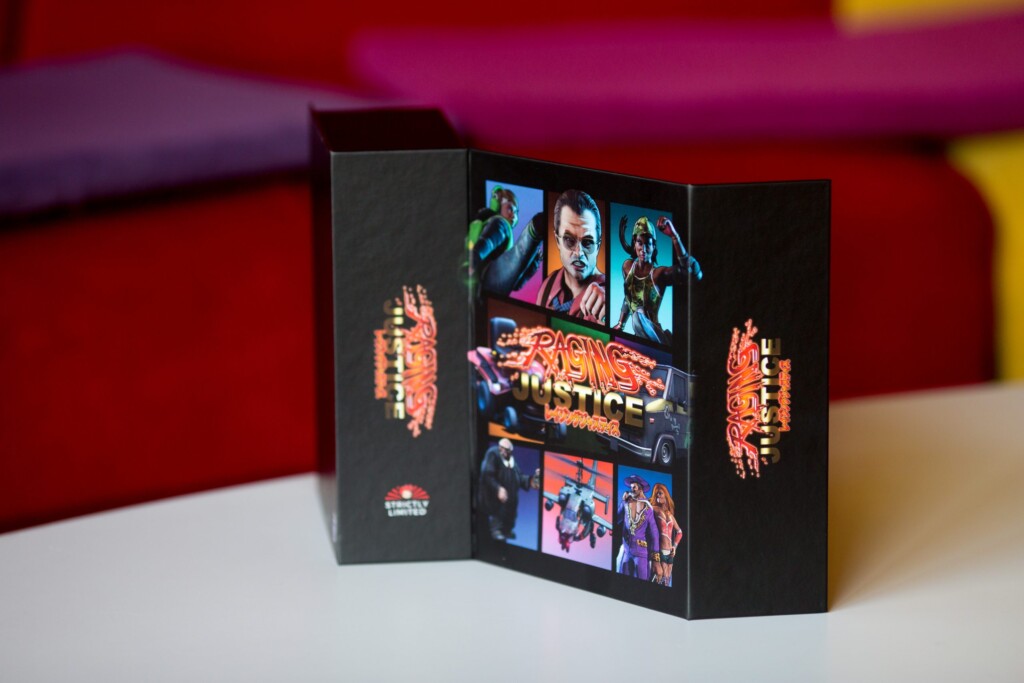 Black rigid box with tri-fold gatefold lid featuring character portraits and orange foil-stamped branding for a video game
