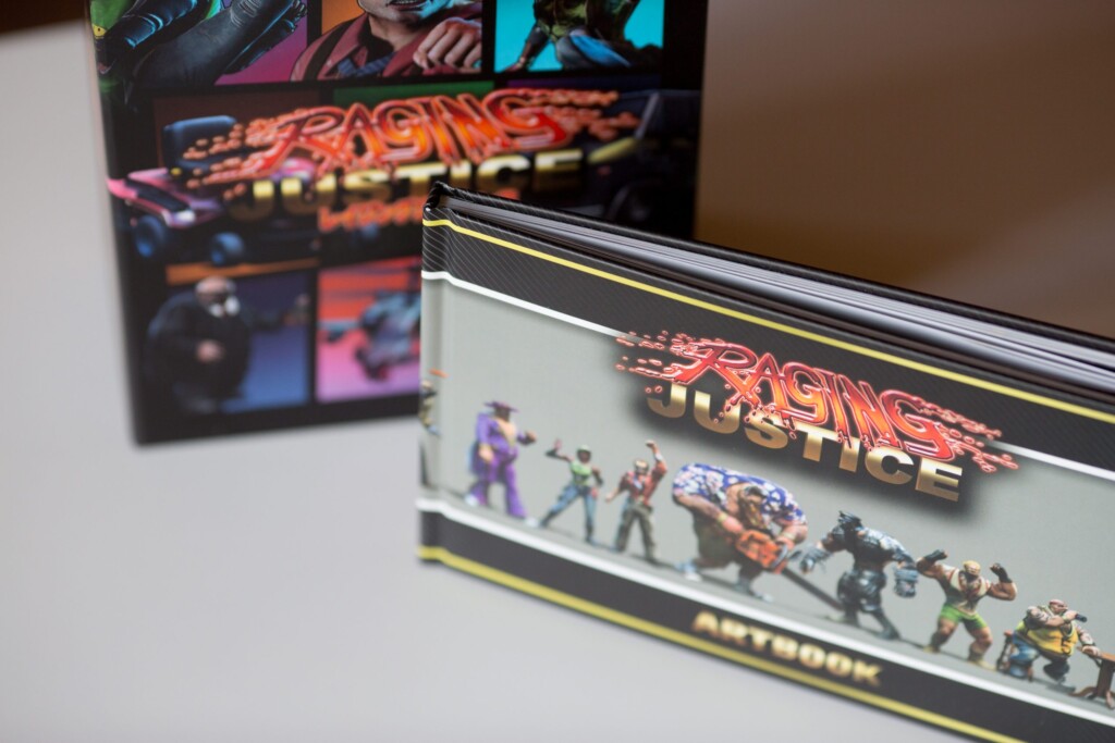 Raging Justice collector's edition hardcover books with foil-stamped covers, stacked and fanned to show spine and character
