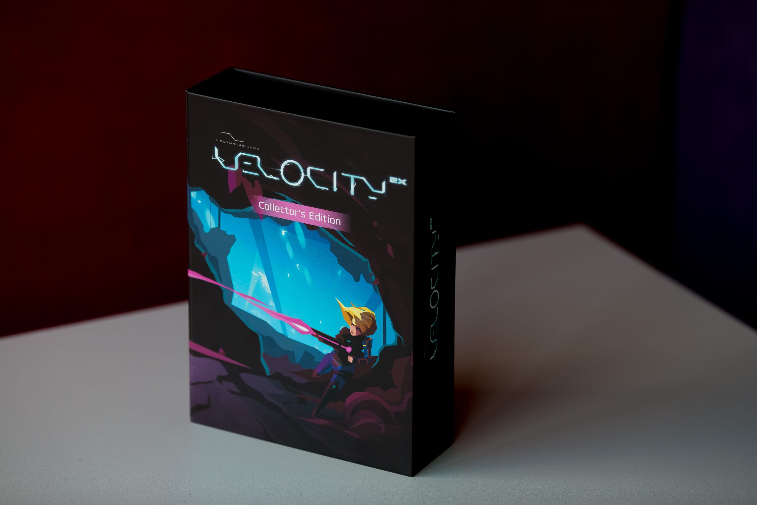 Velocity Collector's Edition video game box with blue holographic cover art and magenta accents on white surface against