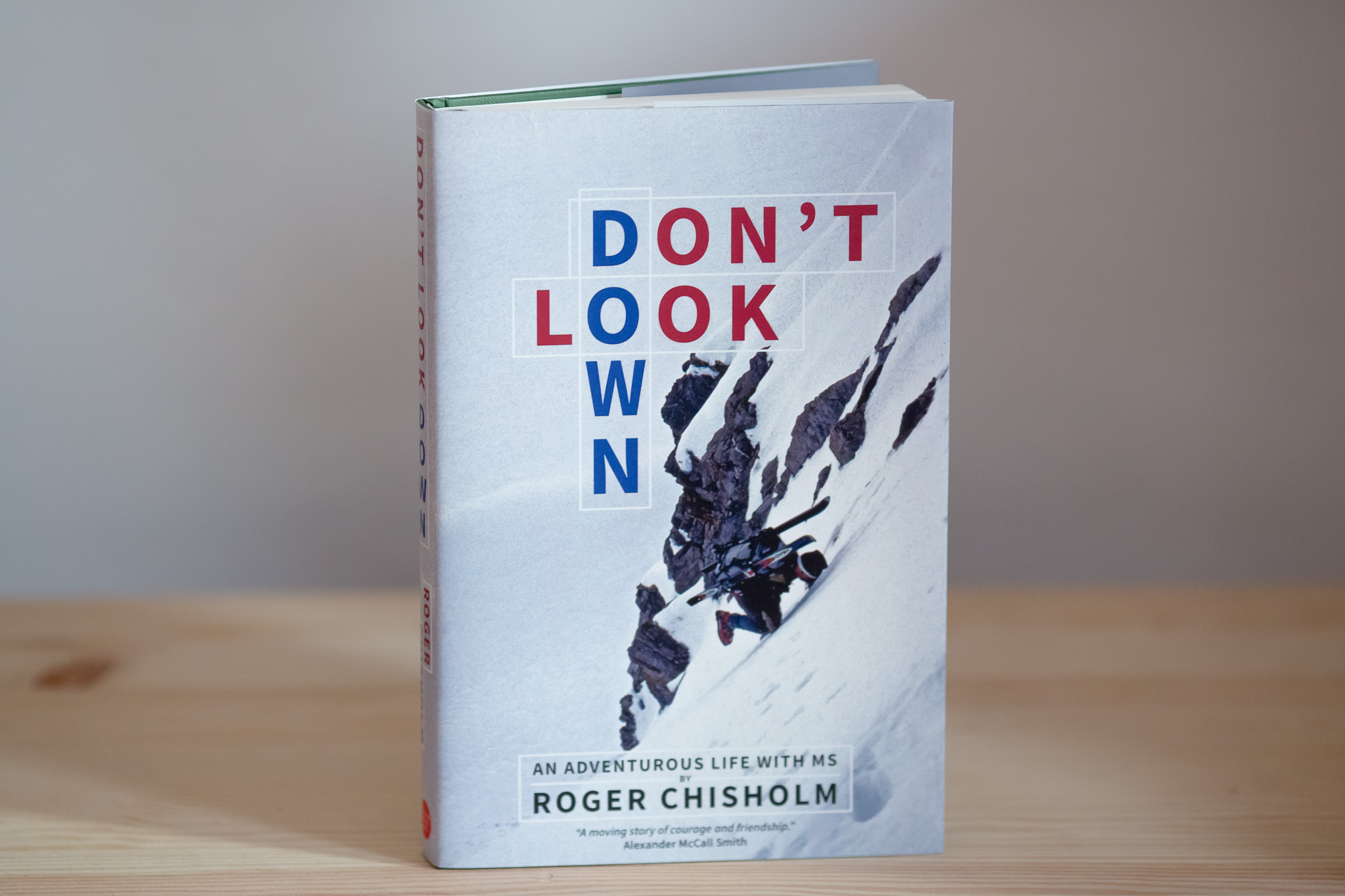 Hardcover book titled "Don't Look Down" with author name Roger Chisholm, featuring a black and white photograph of a person