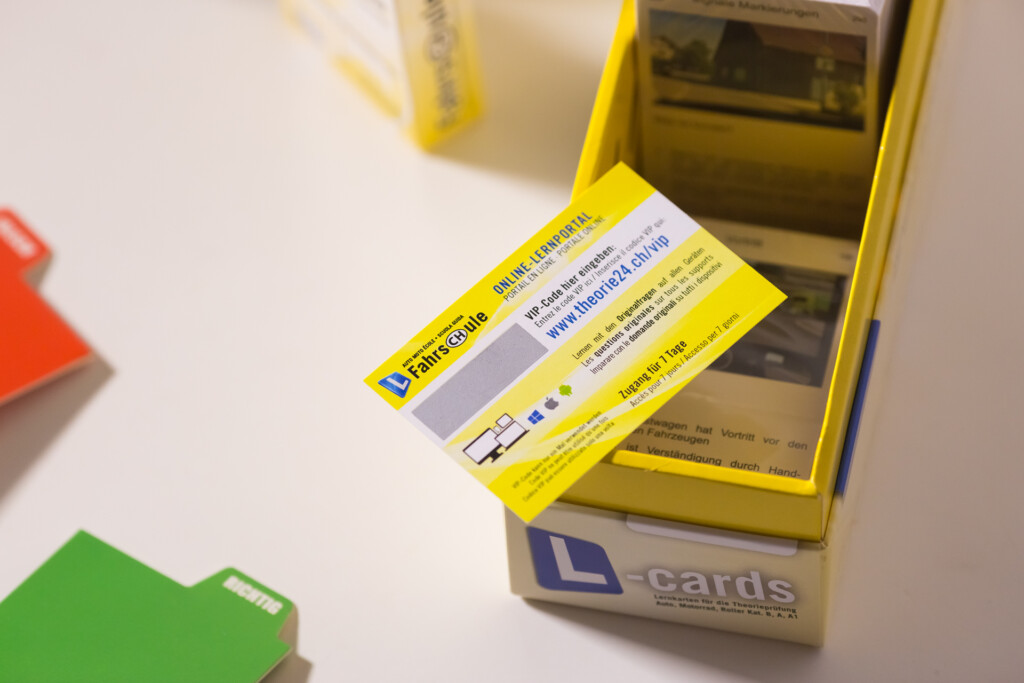 Yellow rigid box with blue learning card insert and product information label visible on top.