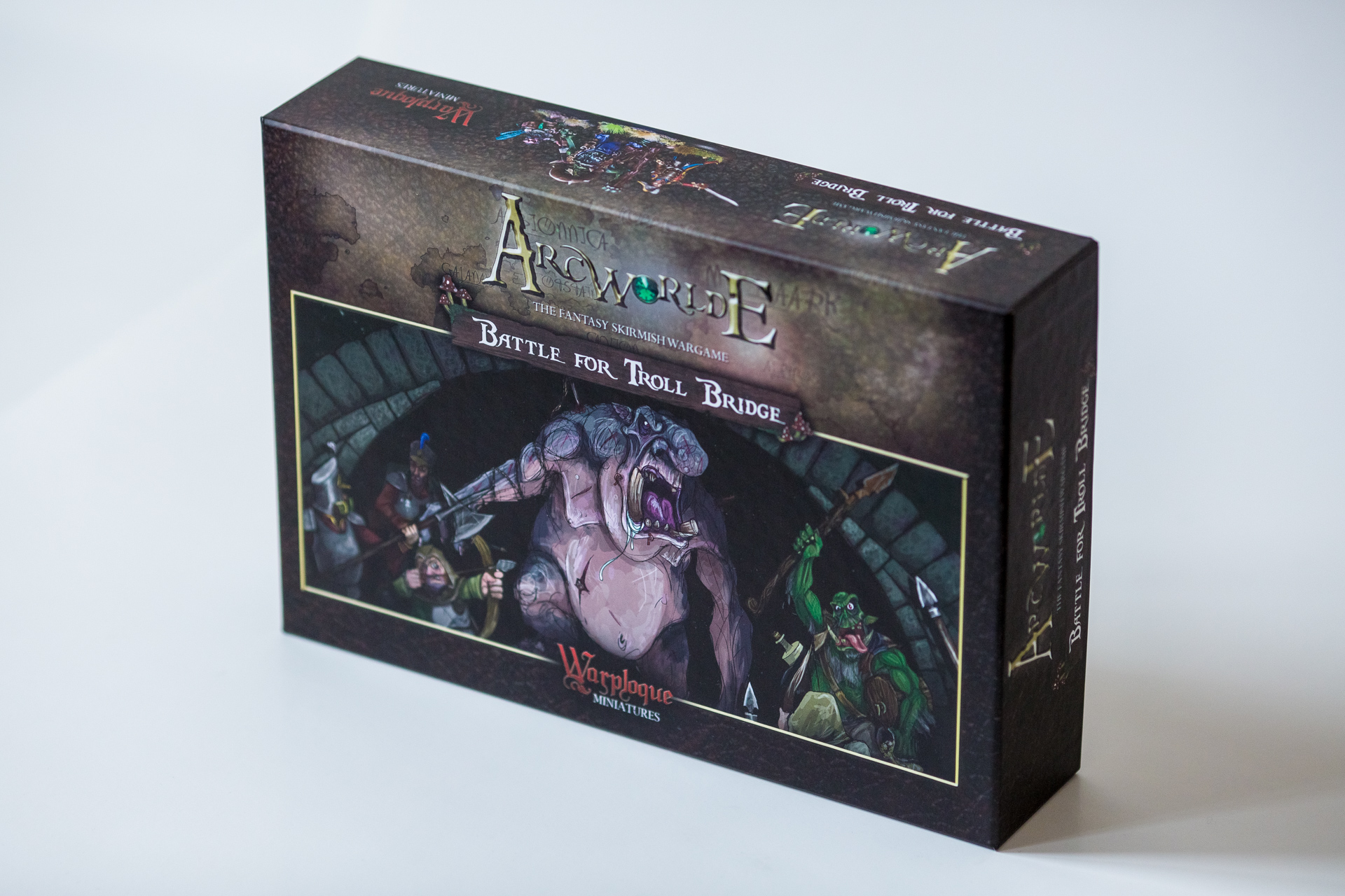 Arcworlds board game box featuring Battle for Troll Bridge, with artwork showing fantasy characters and creatures on dark