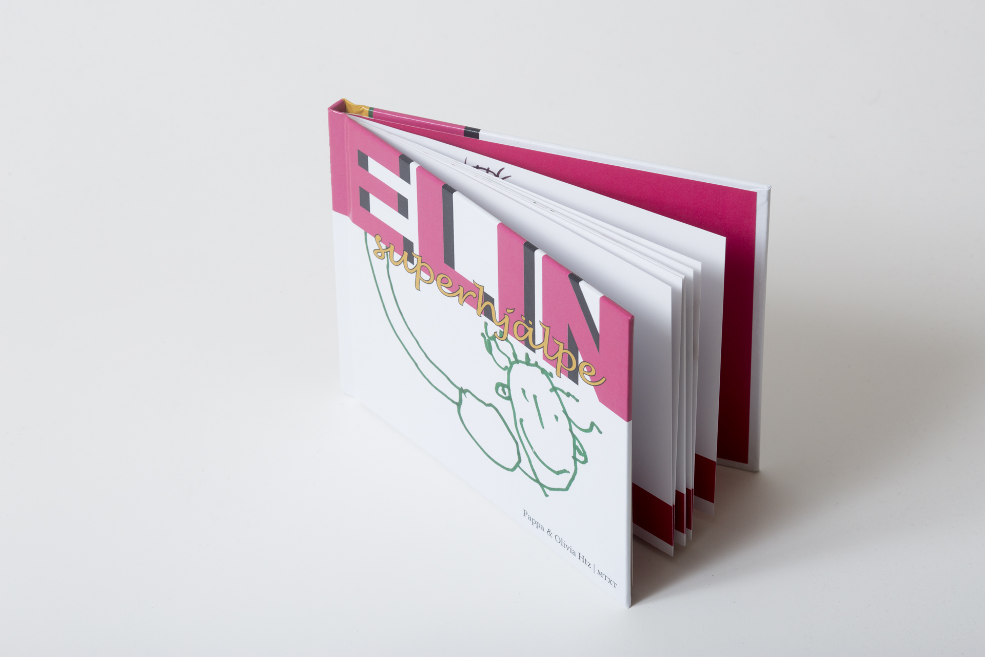 Hardcover book with bright pink boards and white pages, fanned open to display sewn binding and interior spreads with