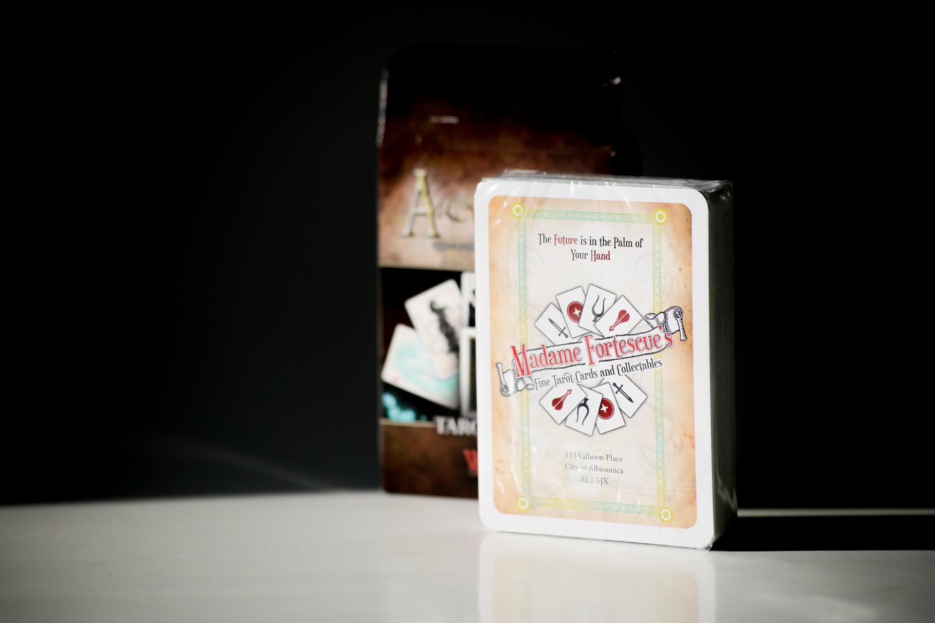 Hardcover book with dust jacket featuring tarot card imagery and "Madame Cartesienne" title, displayed on white surface with