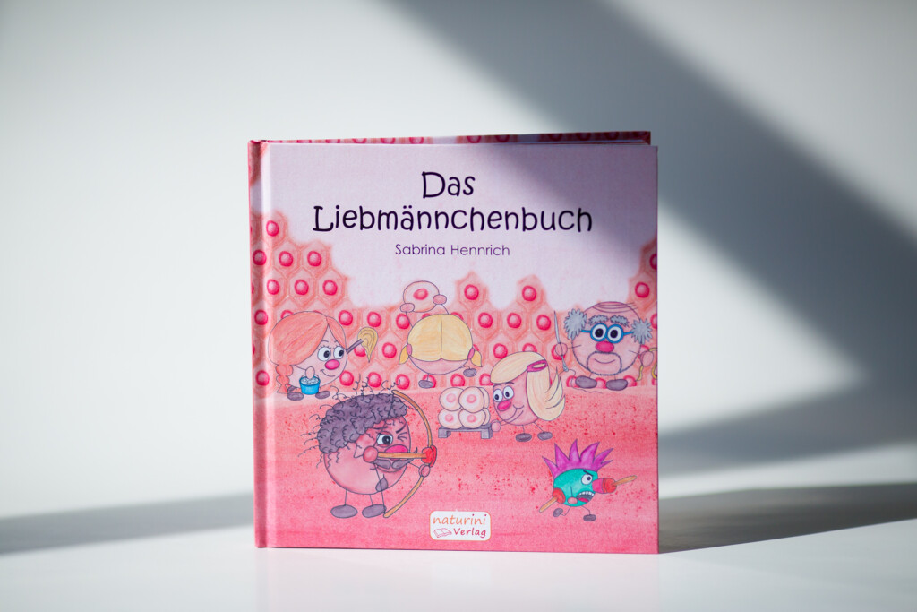 Hardcover children's book titled "Das Liebmännchenbuch" by Sabrina Henreich, with pink cover featuring illustrated