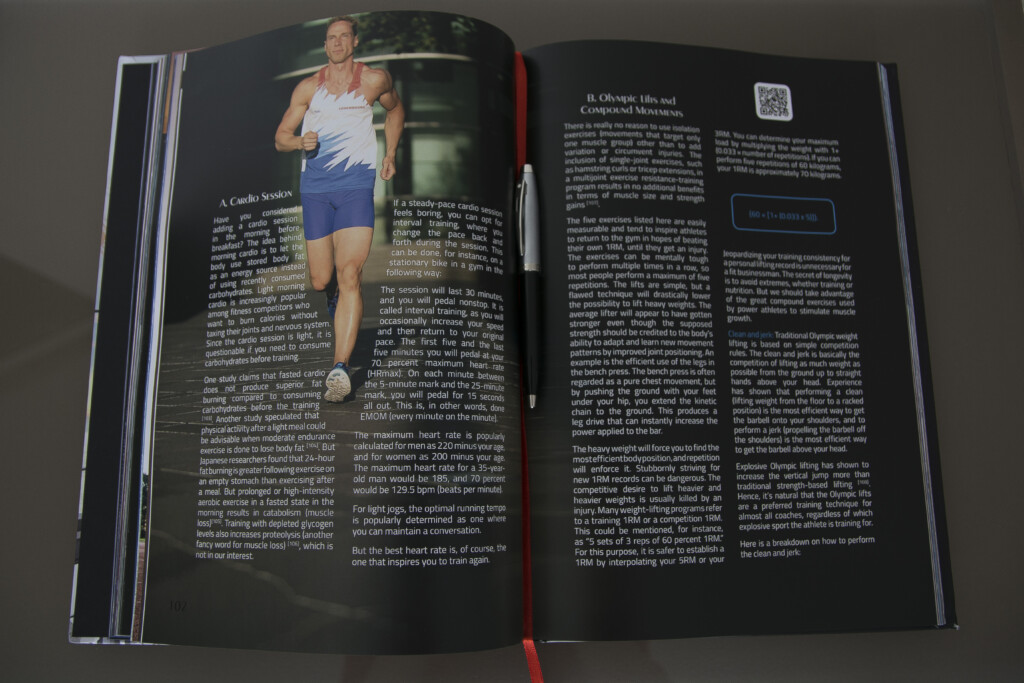 Open hardcover book with text pages and colour photograph of a runner, showing sewn binding and dark paper stock.