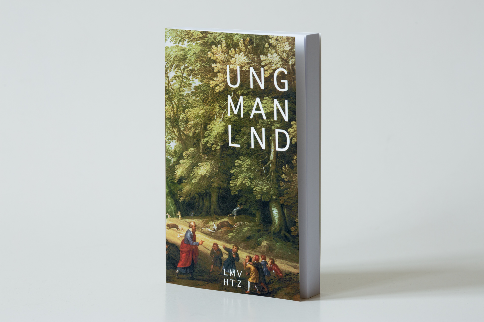 Hardcover book with dust jacket featuring a forest scene and white text reading "UNG MAN LND", displayed at a three-quarter
