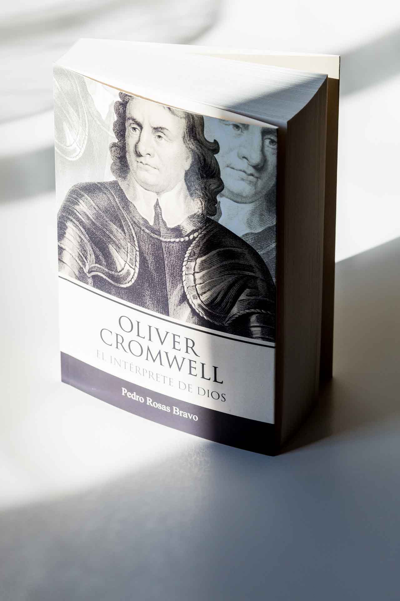 Hardcover book with dust jacket featuring portrait illustrations and text reading "Oliver Cromwell" and "Pedro Rojas