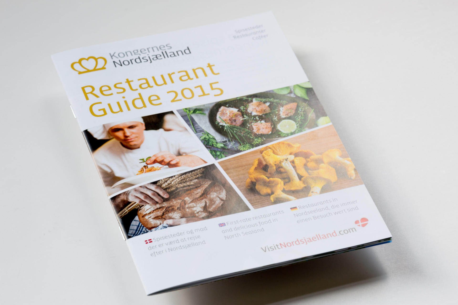 Restaurant Guide 2015 softcover catalogue with colour photography of dishes and chef, featuring gold foil-stamped title and